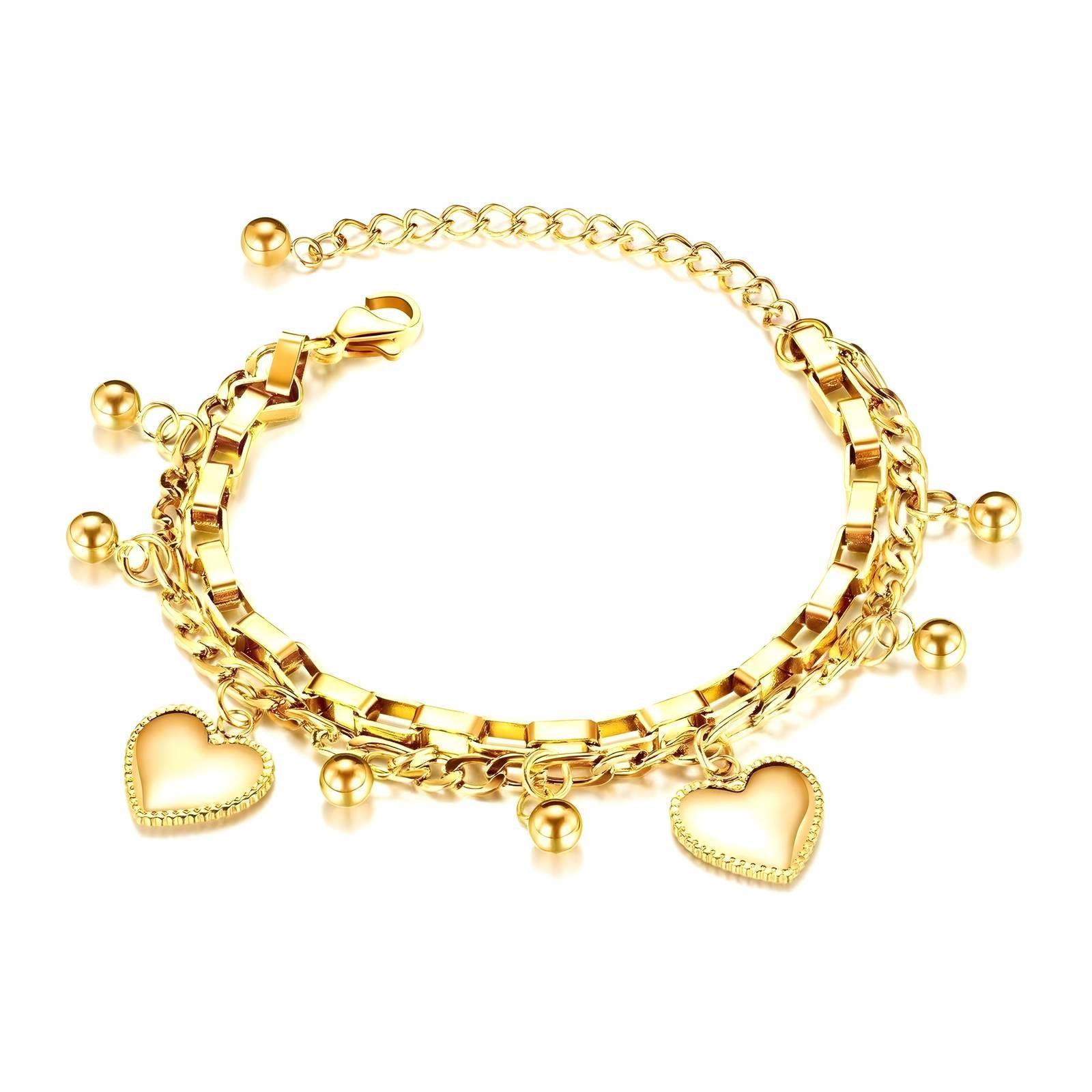 A luxurious 18K gold-plated charm bracelet featuring a mix of box and link chains, adorned with small gold beads and two heart-shaped pendants. The bracelet has an adjustable extension chain for a customizable fit, making it a stylish and versatile accessory for any occasion.