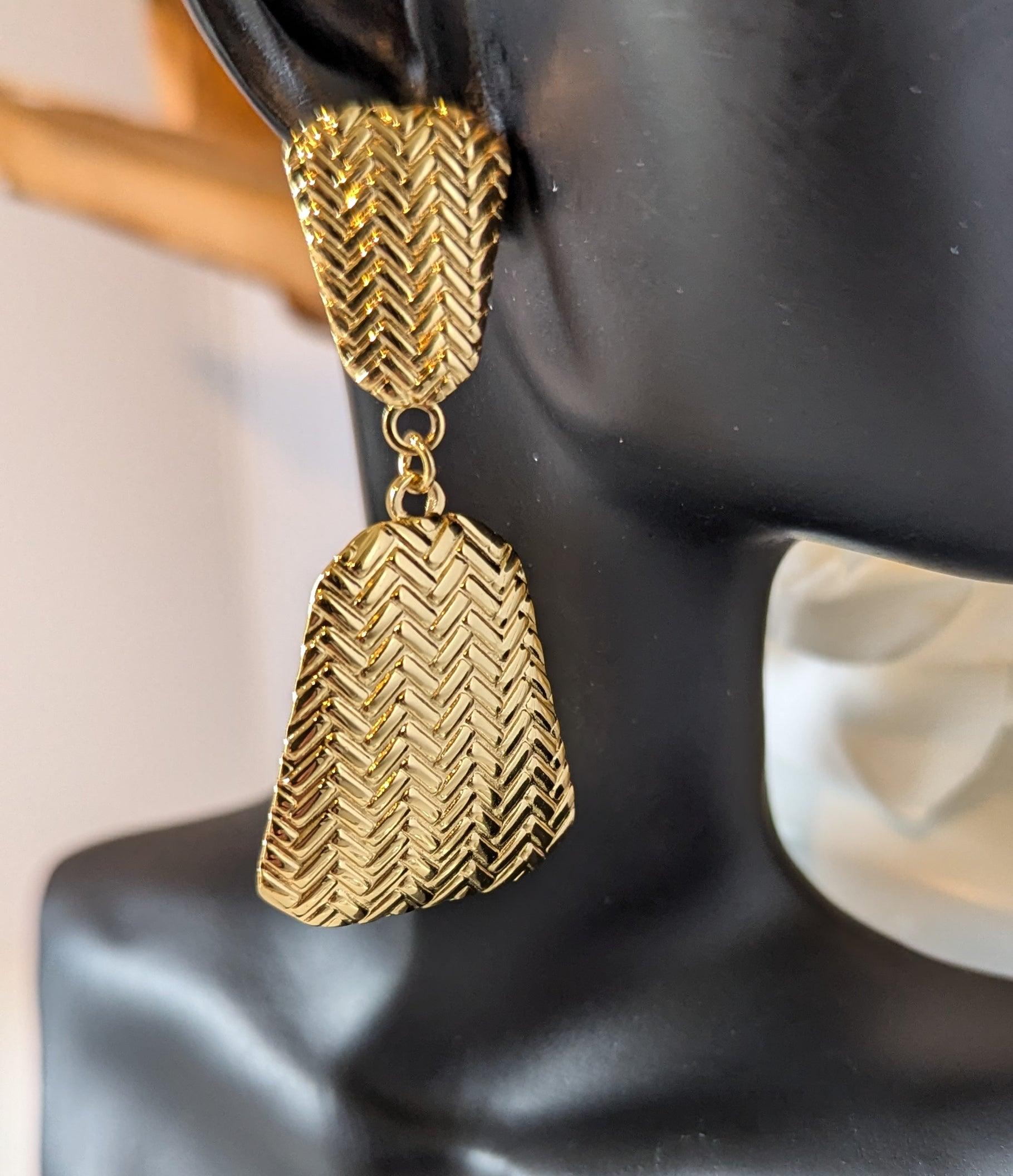Braided Boho Chic Dangle Earrings displayed on a mannequin, showcasing their intricate braided design and 18k gold-plated stainless steel material.