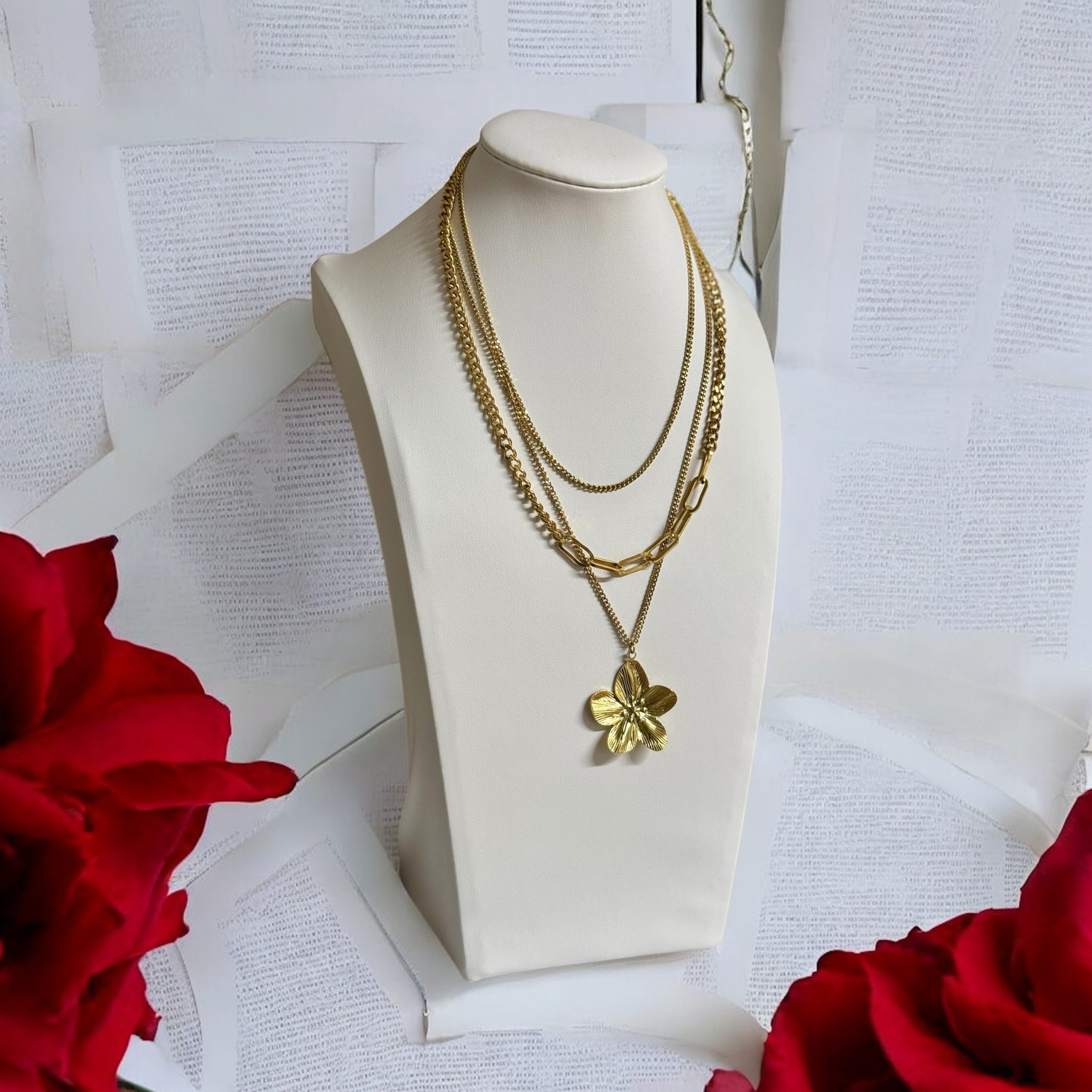Gold layered waterproof necklace with chunky chains and floral pendant, displayed with red roses – 18k gold-plated stainless steel jewellery